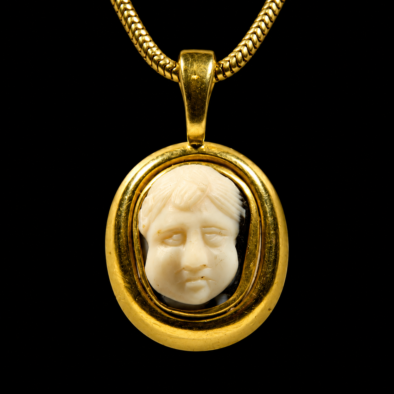 Roman Onyx Cameo with a Facing Head Set in a Gold Pendent
