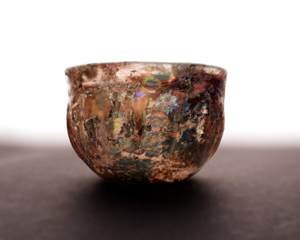 An Aubergine Ribbed Glass bowl