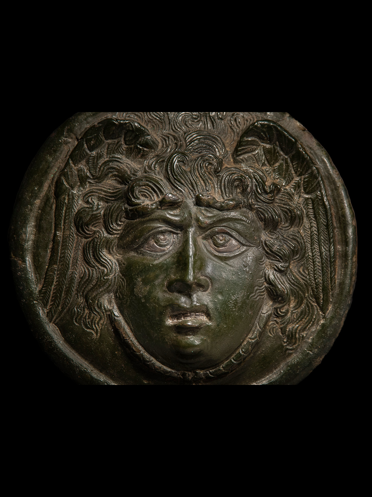 Roman Bronze Medusa Phalera with Silver Inlays