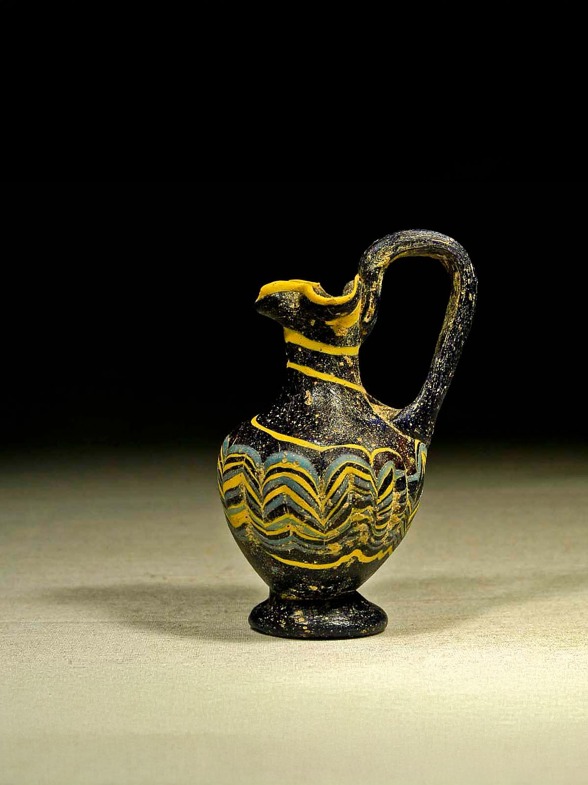 Greek Core Formed Glass Oinochoai