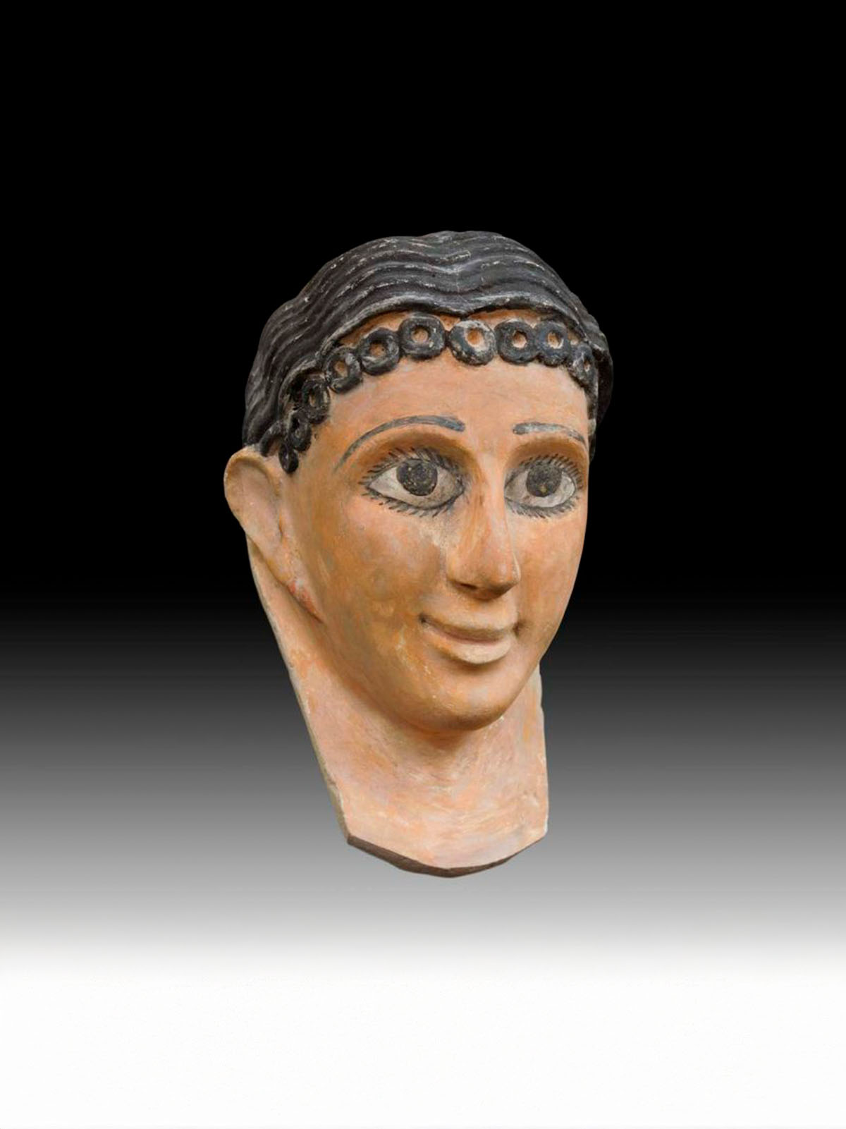 A Fine Egyptian Gypsum Mask of a Young Girl