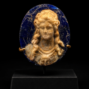 A Roman glass cobalt blue with opaque white cameo depicting Fortuna