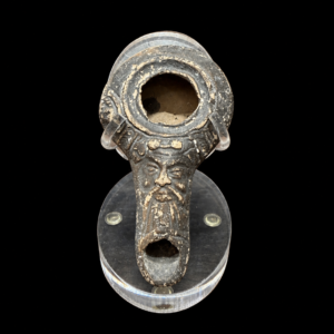 A Greek Black-Slipped Terracotta Oil Lamp With Bearded Mask